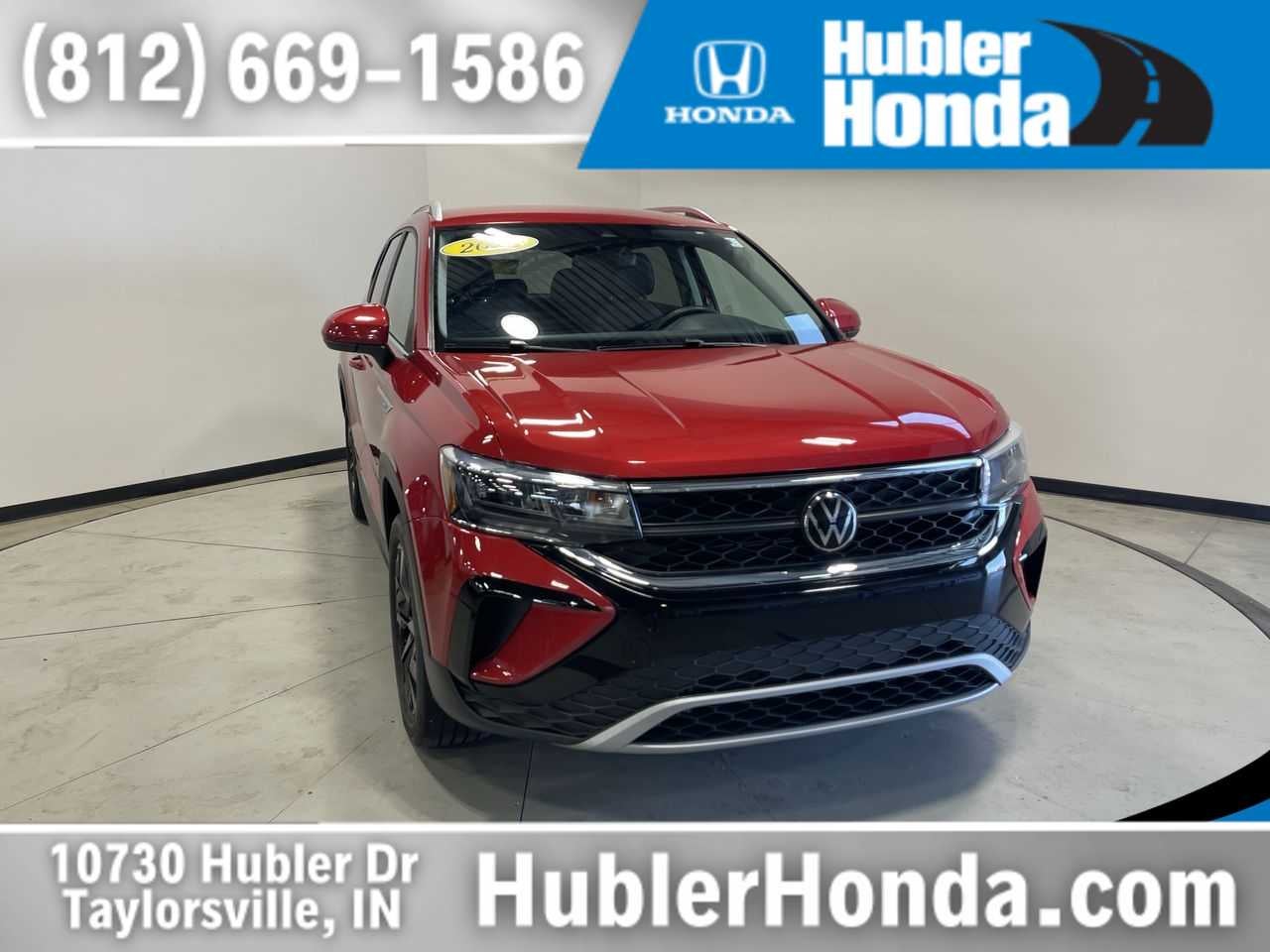 2023 Volkswagen Taos SE in Kings Red — front three-quarter view