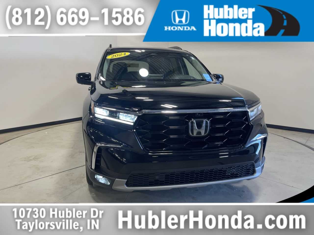 2024 Honda Pilot Elite in Crystal Black Pearl — front three-quarter view