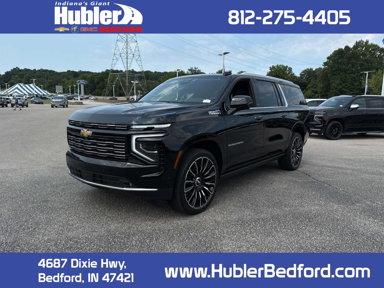 2026 Chevrolet Suburban High Country in Black — front three-quarter view