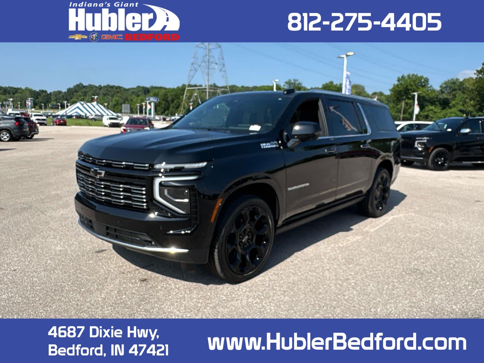 2026 Chevrolet Suburban High Country in Black — front three-quarter view