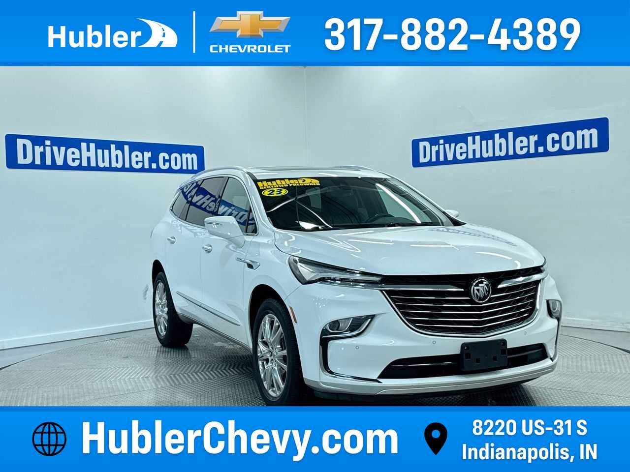 2023 Buick Enclave Essence in Summit White — front three-quarter view
