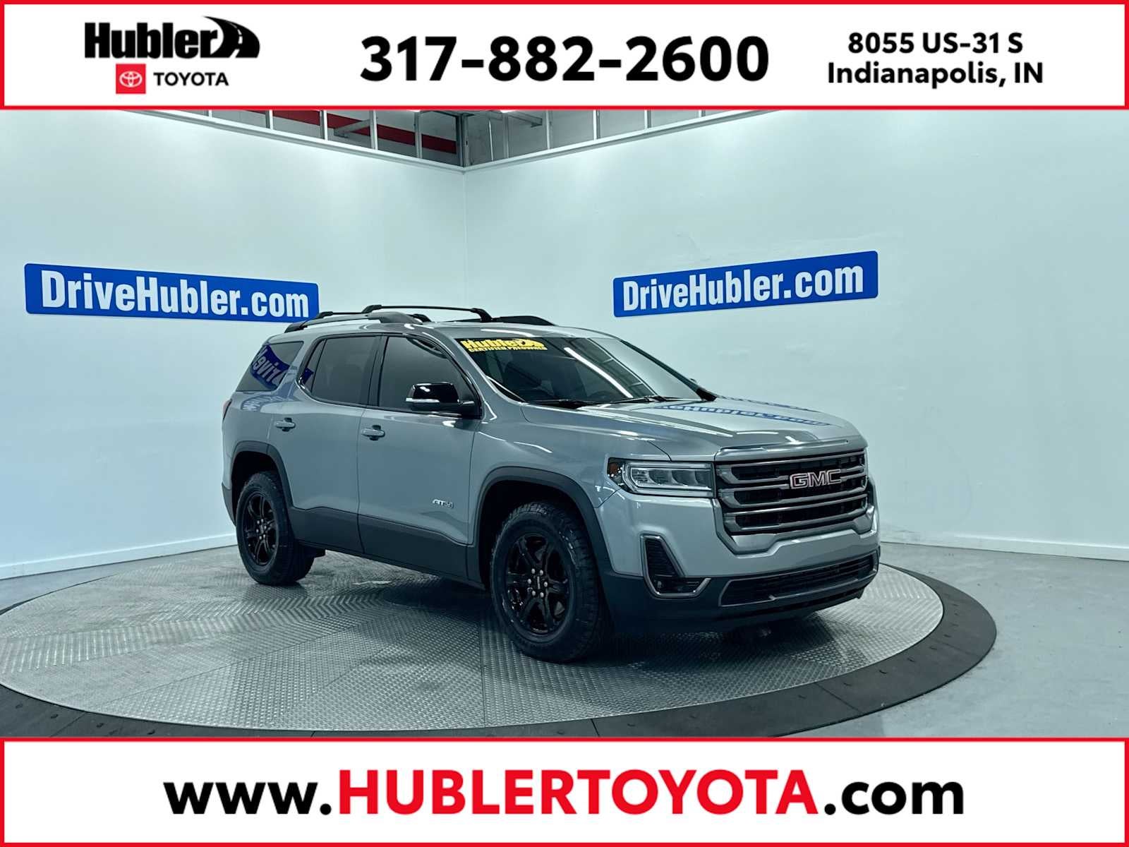 2023 GMC Acadia AT4 in Sterling Metallic — front three-quarter view