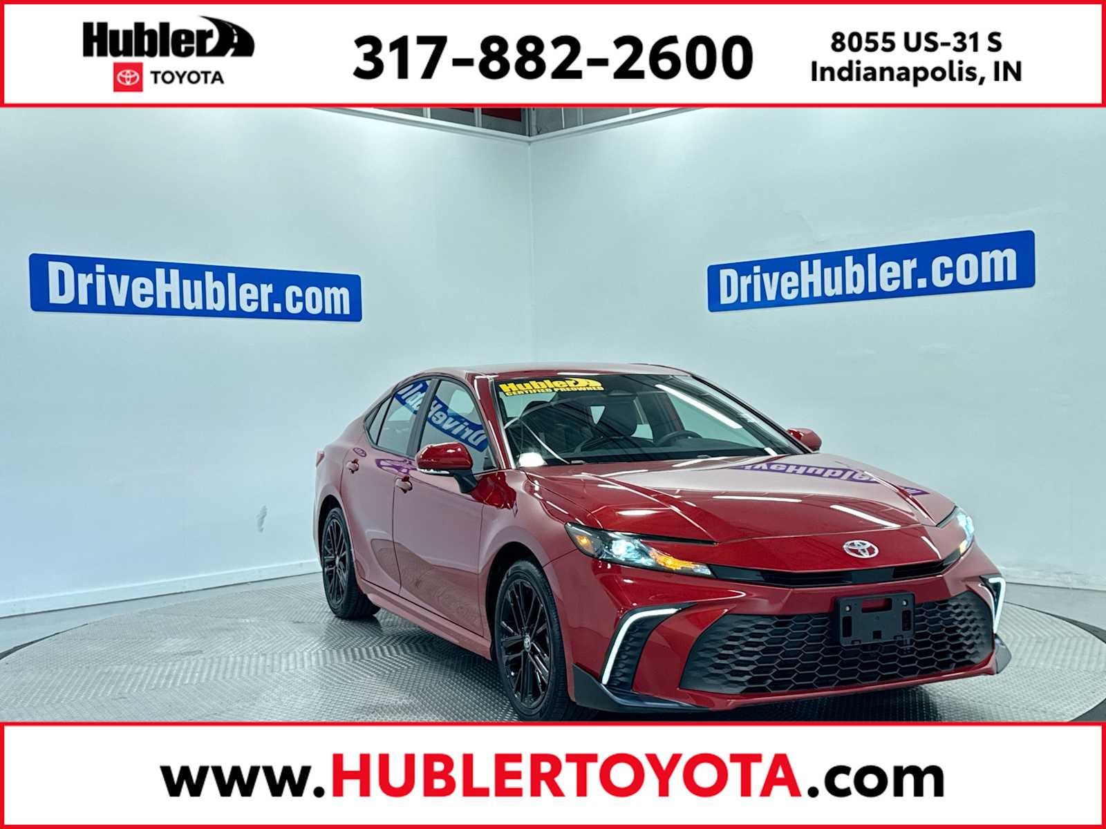 2025 Toyota Camry SE in Supersonic Red — front three-quarter view