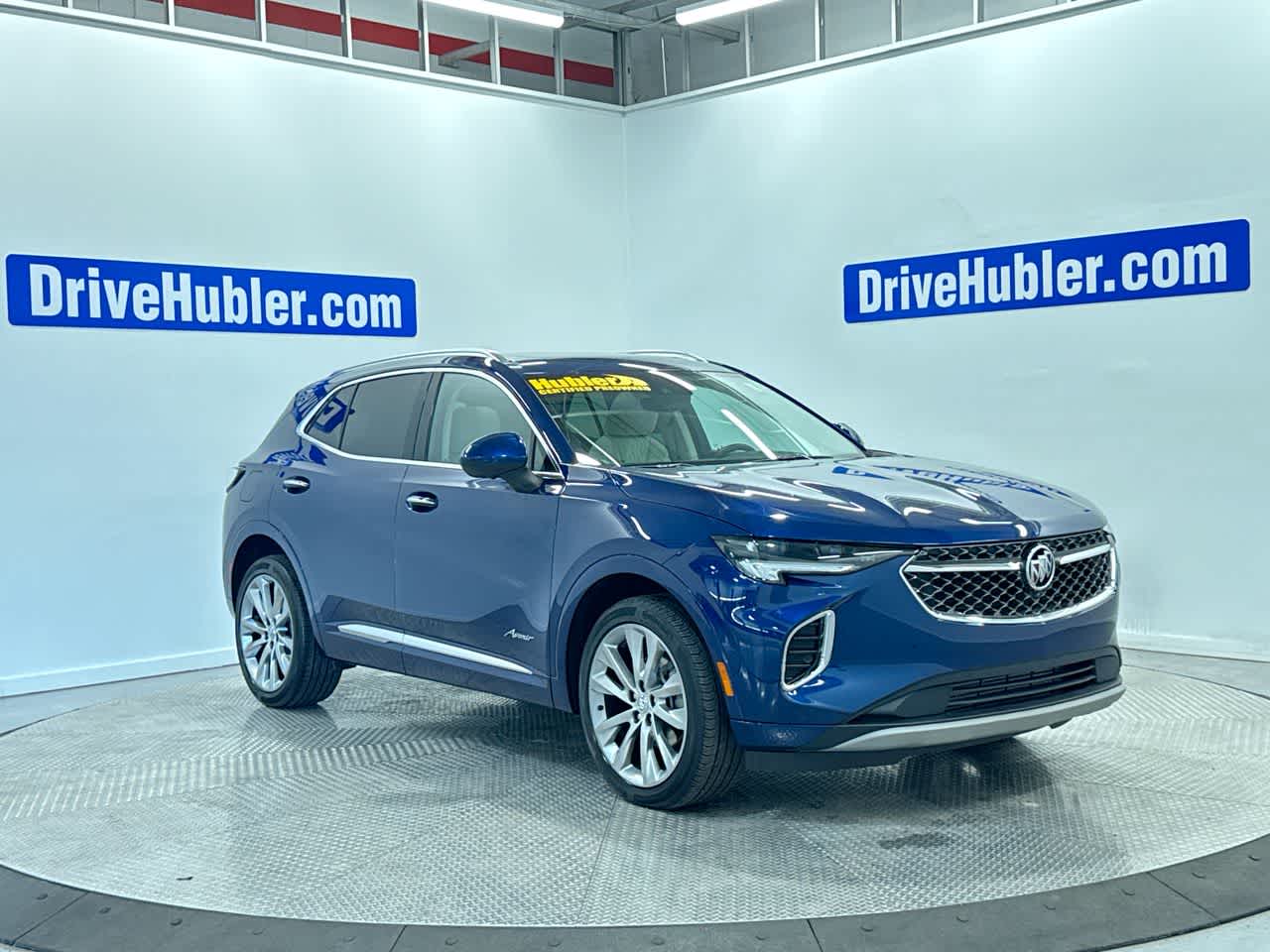 2023 Buick Envision Avenir in Sapphire Metallic — front three-quarter view