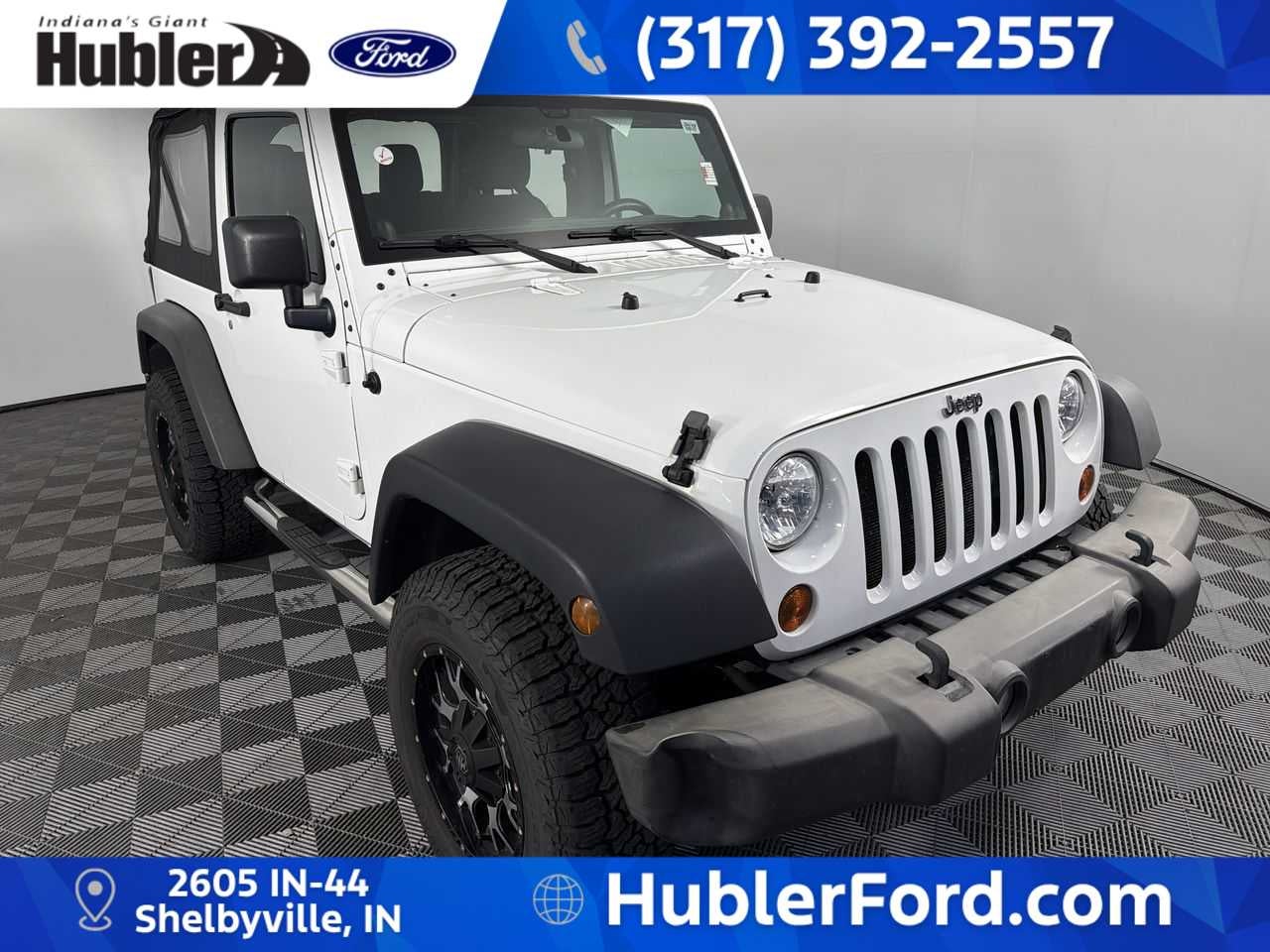 2013 Jeep Wrangler Sport in Bright White — front three-quarter view