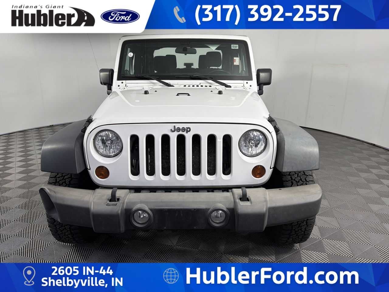 2013 Jeep Wrangler — rear three-quarter view